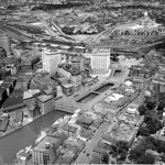 Aerial view of Providence and the Providence River looking in a northerly direction c.1924 includes the north end of Water Street (to the
immediate right of the river) and most of downtown (to the left). Most of
South Main Street is also visible. The State Capitol can be seen in the
distance.