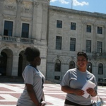 Marielli giving the tour in front of the State House with Bolanle