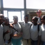  Brian, Providence College student and YouthRAP summer program coordinator, with program participants